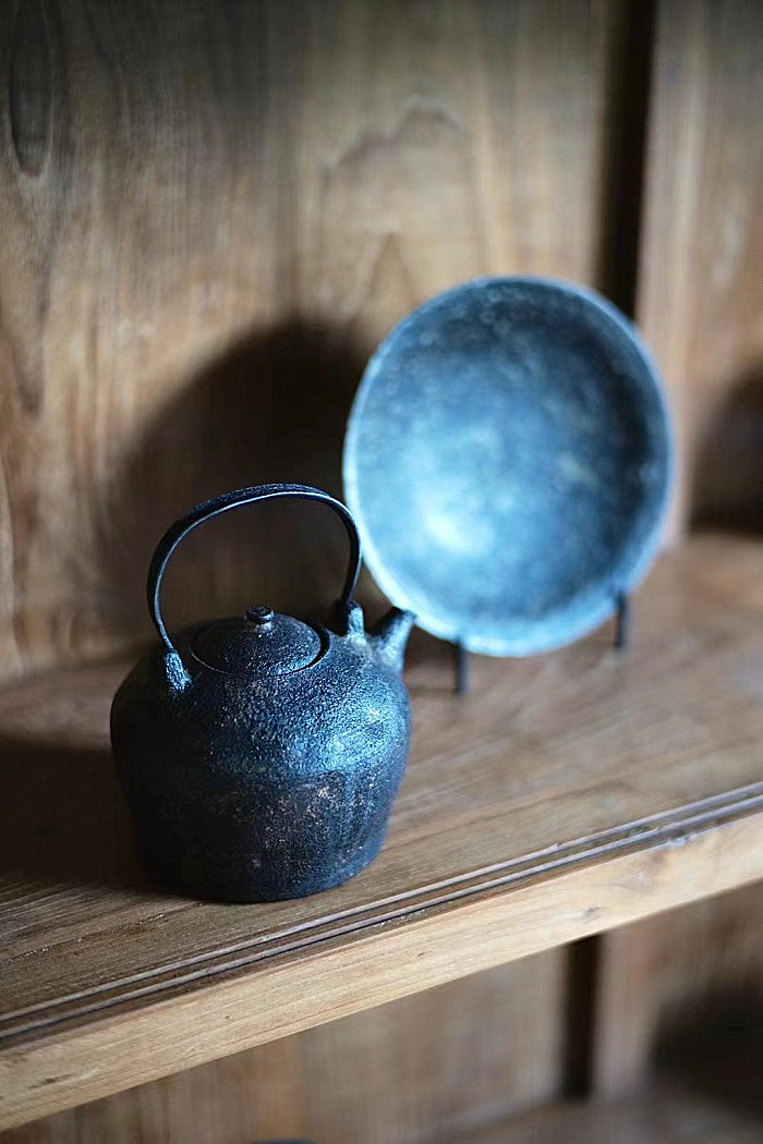 Iron and ceramic tea kettle by Cheng Wei