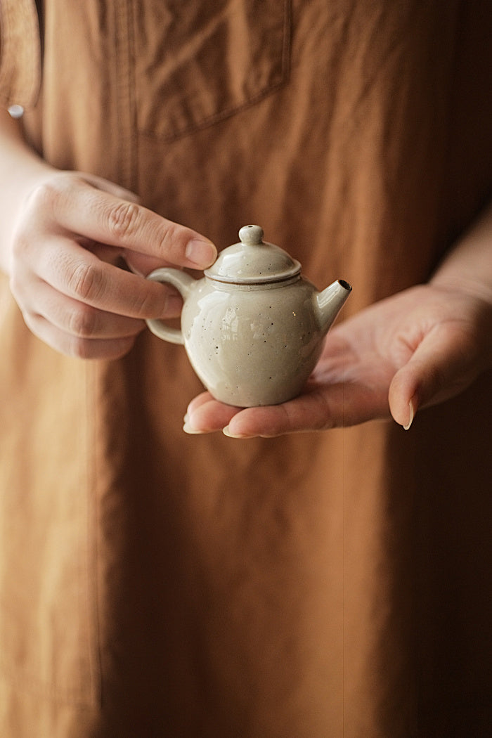 Tall brushed powder-glazed teapot