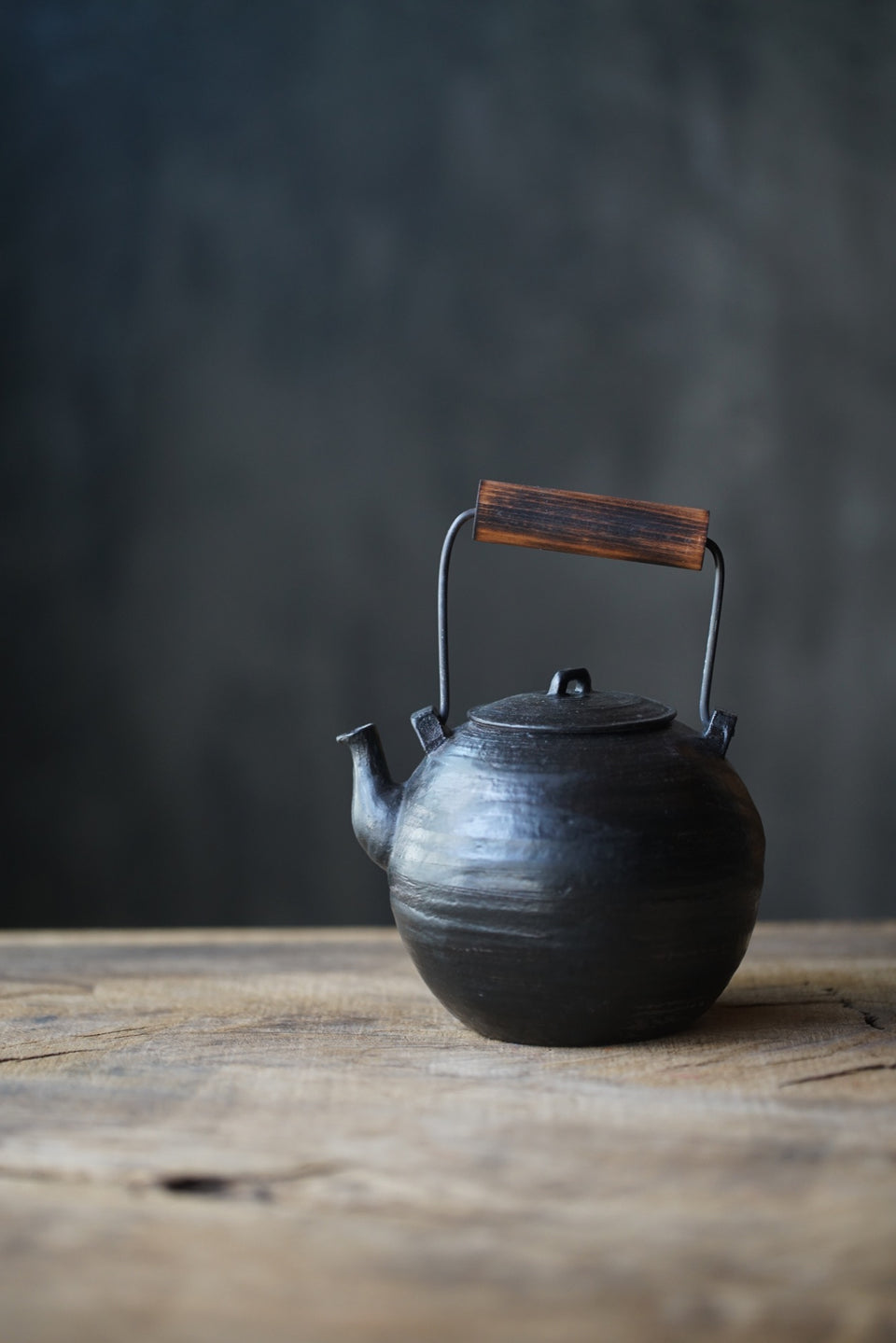 Wood-Handled Ceramic Kettle With Black Glaze